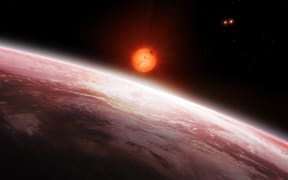 Illustration of the view from the innermost of the two exoplanets orbiting Gliese 667 C (largest star, a red dwarf) in the Gliese 667 system.