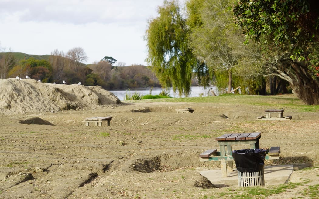 The banks of the Wairoa River, which runs through the town, remain covered in nearly a metre of silt three months after the cyclone.
