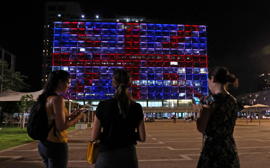 The Tel Aviv Municipality building is illuminated with the colours of the United Kingdom flag as a sign of solidarity to the British royal family following the passing of Queen Elizabeth II on September 9, 2022.