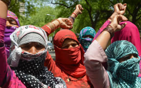 Demonstrating villagers protest in New Delhi against the gang-rape of a lower caste Dalit in nearby Haryana state.