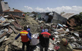 The death toll from the 7.7-magnitude earthquake and tsunami on the island of Sulawesi has risen to 1,203, the country's disaster management agency said on Sunday.