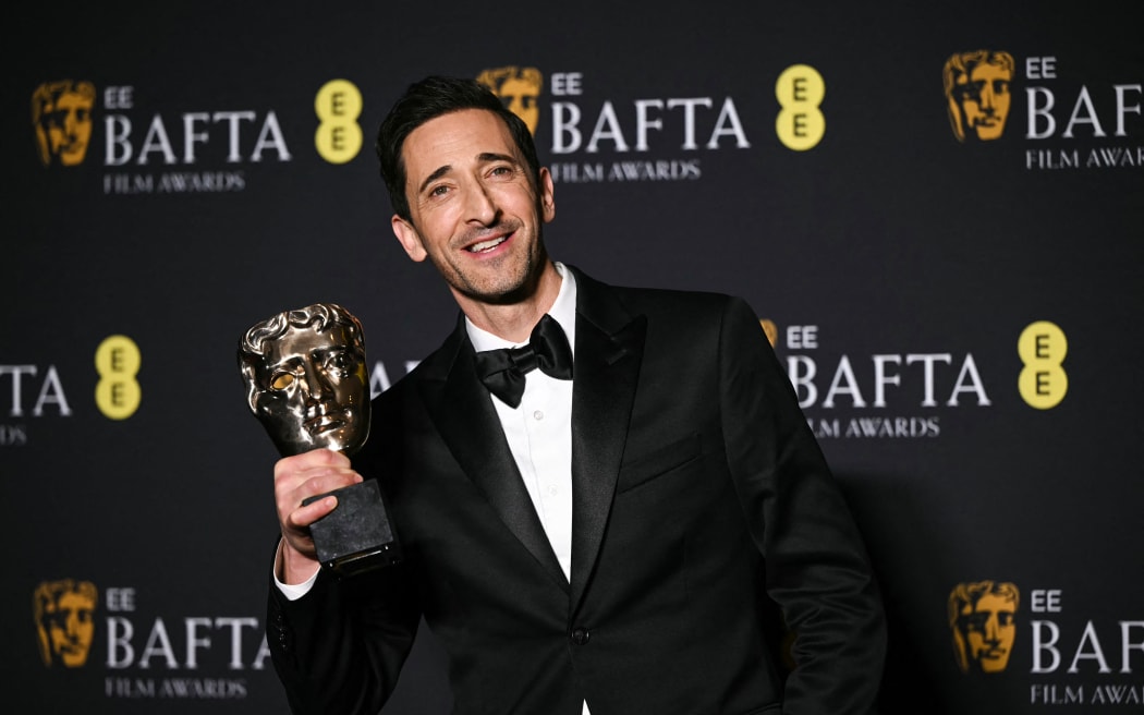 US actor Adrien Brody poses with the award for Best leading actor for "The Brutalist" during the BAFTA British Academy Film Awards ceremony at the Royal Festival Hall, Southbank Centre, in London, on February 16, 2025. (Photo by JUSTIN TALLIS / AFP)