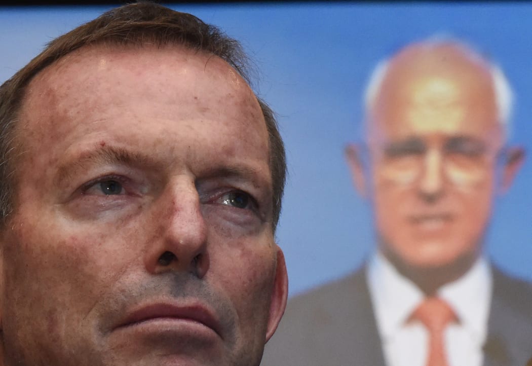 Tony Abbott listens to Australian Prime Minister Malcolm Turnbull address party members at the Coalition Campaign Launch in Sydney on 26 June, 2016.