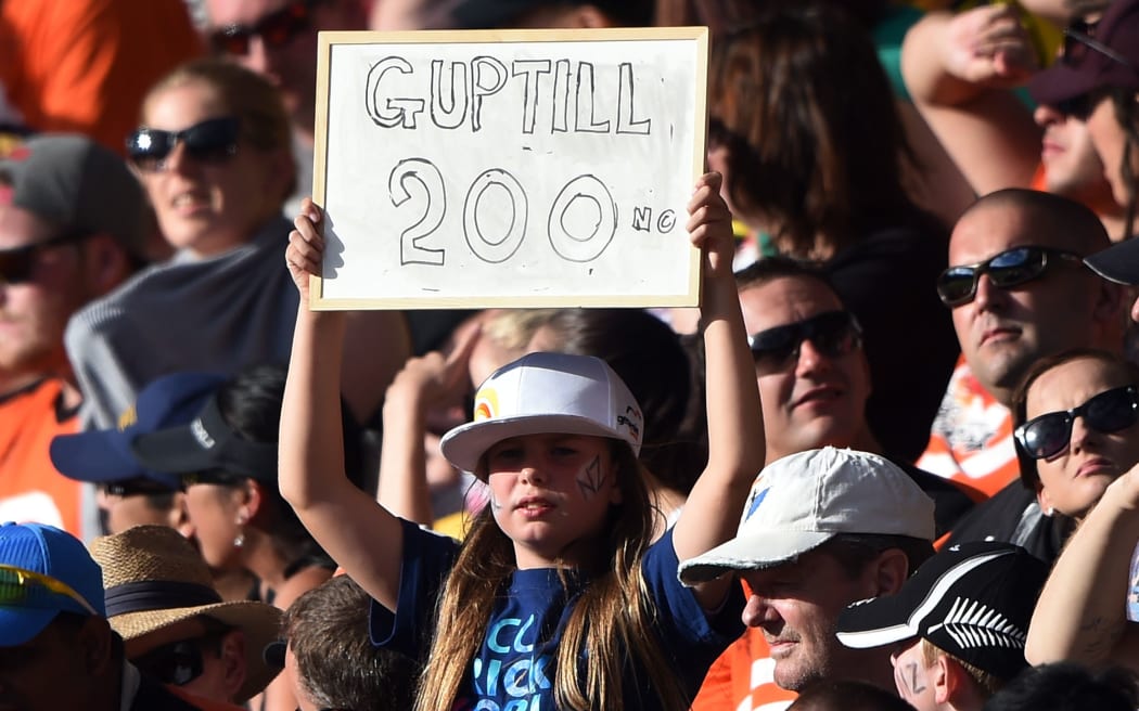 Black Caps fans celebrate Martin Guptill's double century against the West Indies.