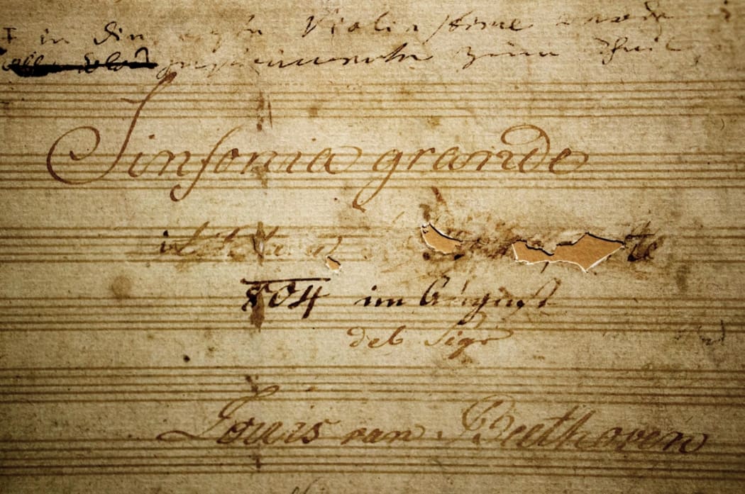 Title page from the Eroica Symphony manuscript showing Beethoven's removal of the dedication to Napoleon.