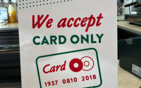 A card only sign at Krispy Kreme Doughnuts in Auckland