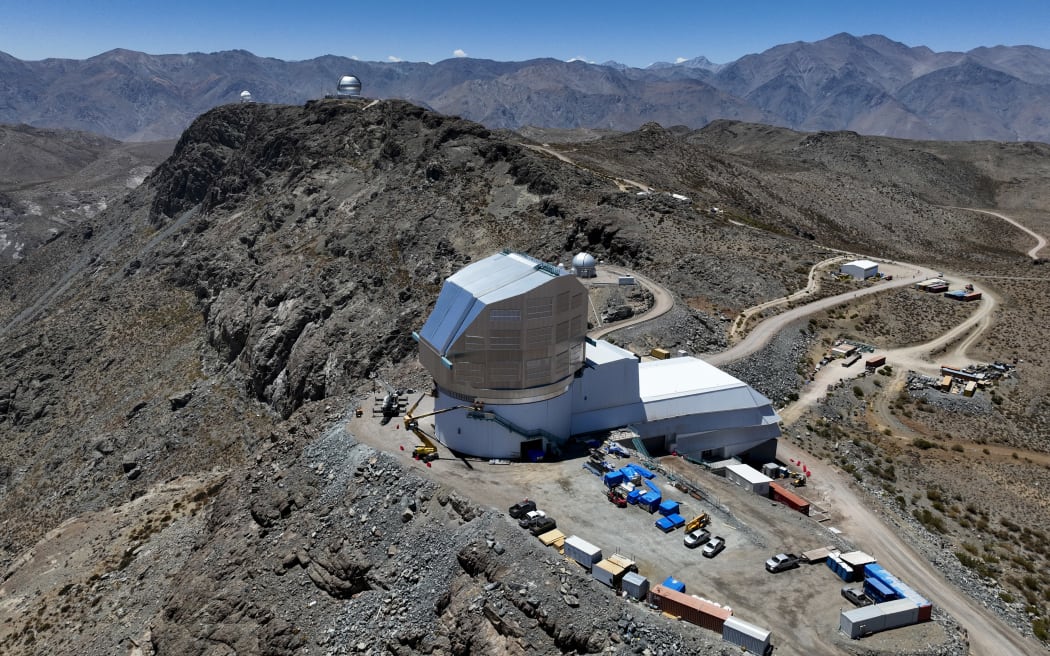 Aerial view of Vera C. Rubin Observatory located in the Pachon hill, approximately 80 km from the city of La Serena, in the Coquimbo Region, Chile, taken on January 24, 2024. Surrounded by desert-like mountains and under the blue skies of northern Chile, the Vera C. Rubin Observatory will revolutionize the study of the universe when it incorporates the largest digital camera ever built in the world. (Photo by Javier TORRES / AFP)