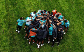 The Flying Fijians come together in training.