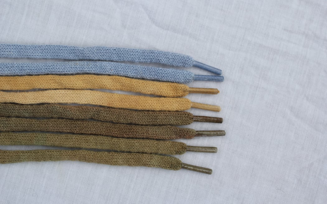 A collection of coloured shoelaces made of wool