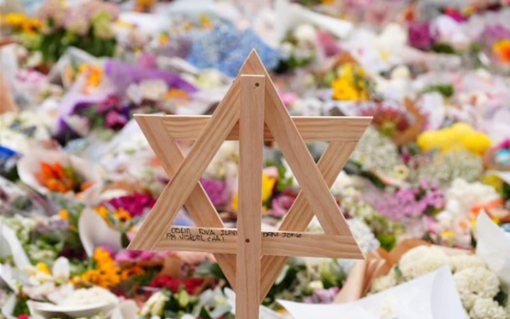 A vigil in Bondi Beach has attracted thousands in the wake of the attack. (ABC News: Jack Fisher)