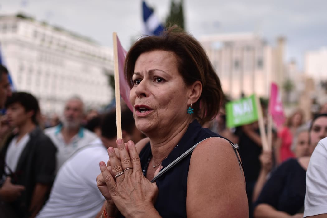 Pro-eurozone protesters gather in front of the parliament building in Athens on 30 June.