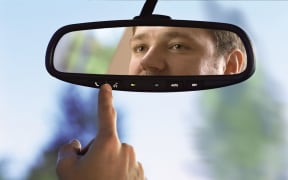 A driver checks his rear view mirror (file)