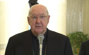 This photo taken and handout on April 21, 2025 by The Vatican Media shows cardinal Kevin Farrell, Camerlengo of the Holy Roman Church announcing the death of Pope Francis in The Vatican. (Photo by Handout / VATICAN MEDIA / AFP) / RESTRICTED TO EDITORIAL USE - MANDATORY CREDIT "AFP PHOTO / VATICAN MEDIA" - NO MARKETING - NO ADVERTISING CAMPAIGNS - DISTRIBUTED AS A SERVICE TO CLIENTS
