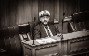 Labour's Chief Whip and cricket fan Kieran McAnulty goes ye olde parliament with a 'steady the ship' captains cap.