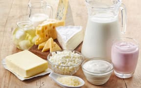 Various fresh dairy products on wooden background