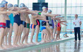 Children learning how to swim
