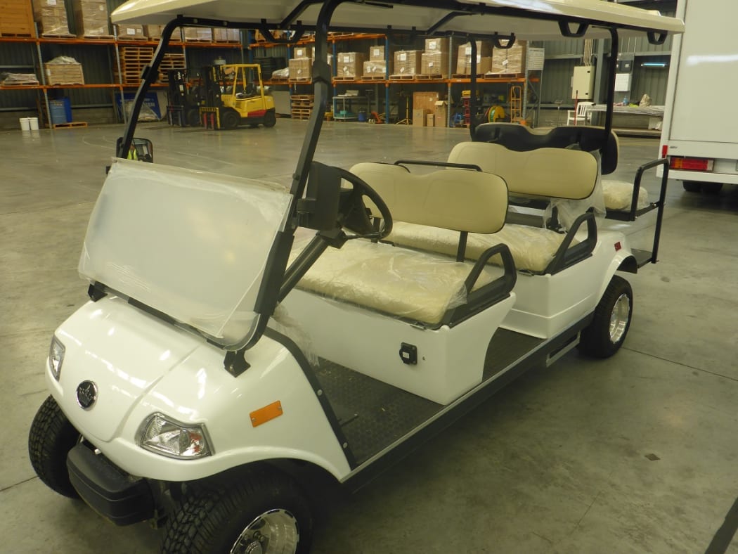 Drugs and firearms were found in the batteries of a golf cart in a shipping container.