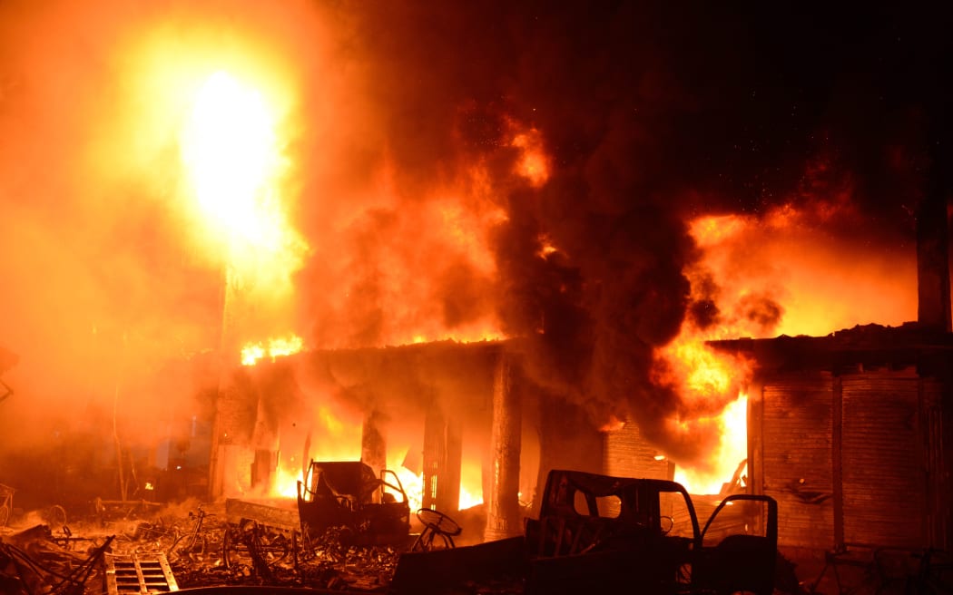 Flames and smoke rise from building after a fire broke out in an old part of the Bangladeshi capital Dhaka on February 21, 2019.