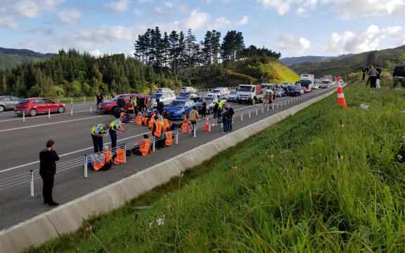 Protesters block traffic on Transmission Gully, Wellington, on 19 October 2022.