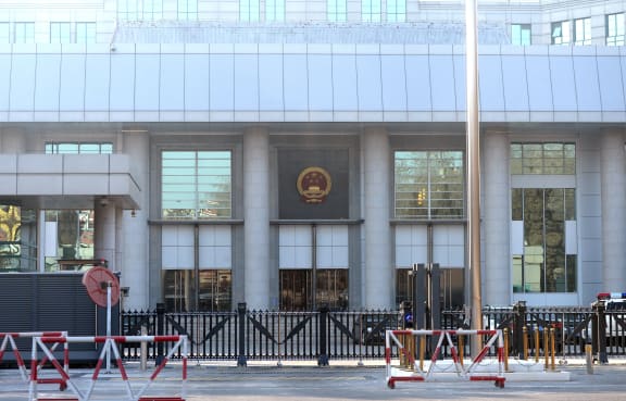 Barricades were set up outside the Beijing court as tight security was imposed.