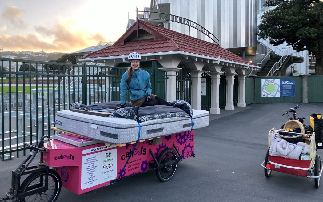 Beth Walker atop Jade Musther's custom built electrically assisted bike trailer. Adelaide Road's cycle lane proved too narrow for the heavily laden bike.