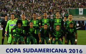 This file photo taken on November 24, 2016 shows Brazil's Chapecoense players posing for pictures during their 2016 Copa Sudamericana semifinal second leg football match against Argentina's San Lorenzo held at Arena Conda stadium, in Chapeco, Brazil.