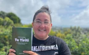 Roimata Smail with her book