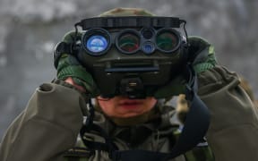 Thermal binoculars are used during 'Train With The Army' military training run by 16th Airborne Battalion in Krakow, Poland on Fabruary 4, 2023. This free-of-charge initiative of the Polish Ministry of National Defense aims to provide citizens with basic military skills and encourage additional volunteers to join the country’s armed forces. During classes, military instructors teach participans weapons handling, survival fundamentals, and first medical aid. The program has gained a lot of interest among civilians during the ongoing Russian invasion on Ukraine. (Photo by Beata Zawrzel/NurPhoto) (Photo by Beata Zawrzel / NurPhoto / NurPhoto via AFP)