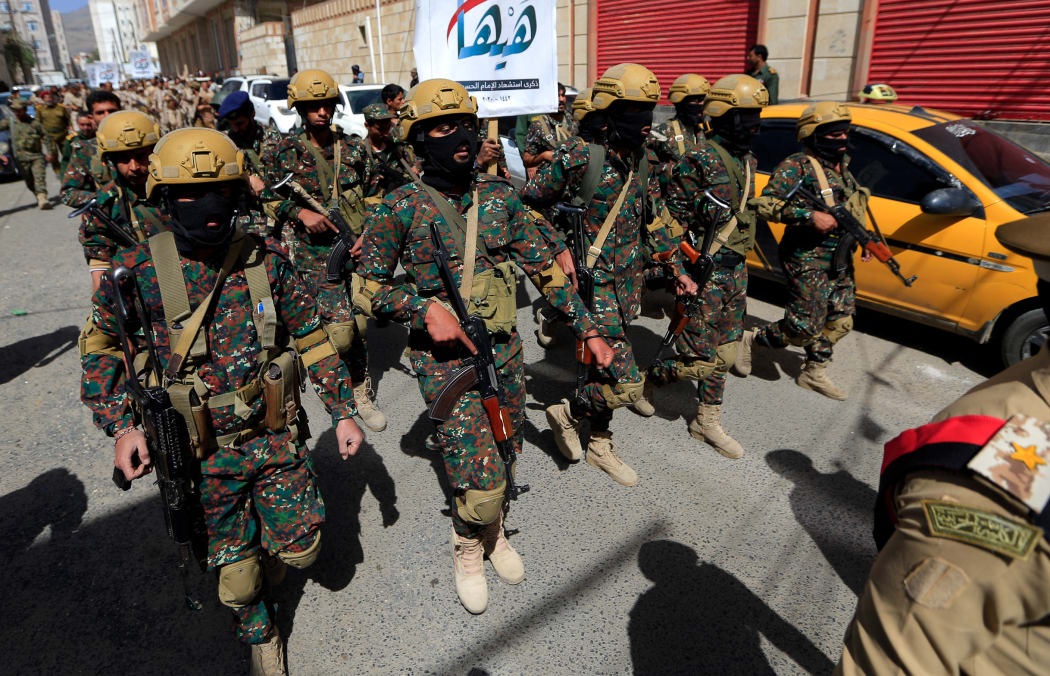 Forces loyal to Yemen's Houthi group take part in a military parade marking the seventh anniversary of the Saudi-led coalition's intervention in their country, in the capital Sanaa, on March 31, 2022.