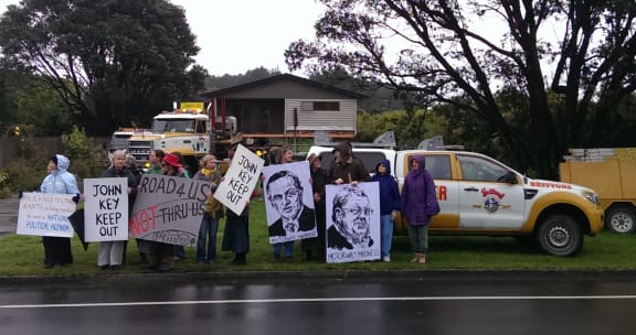 Kapiti residents protesting against the demolition of houses for a planned expressway.