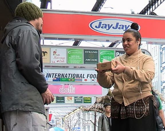 This is  an image of a  woman offers Jason her lunch