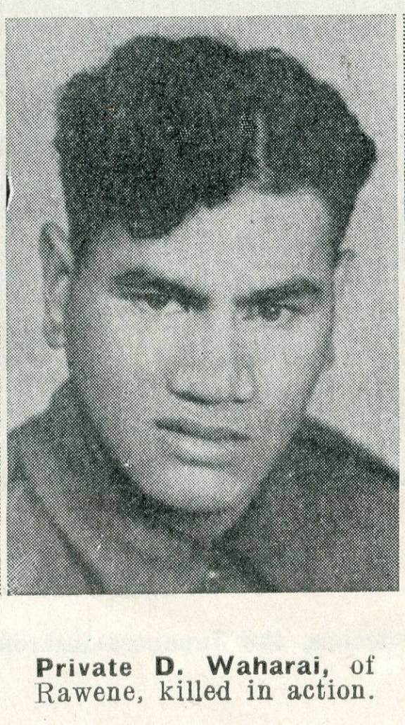 An old photo of Dan Waharai. He is wearing army uniform and looking at the camera with a serious expression. Below, text reads "PRIVATE D. WAHARAI, OF RAWENE, KILLED IN ACTION"