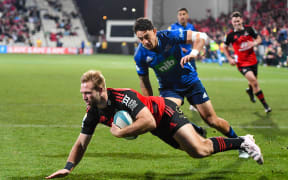 Braydon Ennor of the Crusaders scores a try during the Super Rugby Pacific Rugby Semi Final match against the Blues at Orangetheory Stadium.