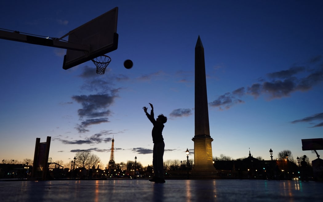 A man plays basketball at the Place de la Concorde which is the venue of the BMX freestyle, Skateboarding, Breaking and 3×3 basketball at Paris Olympics in Paris, France on Feb. 12, 2024. 2024 Summer Olympics and Paralympics will be held in Paris. ( The Yomiuri Shimbun ) (Photo by Kaname Muto / Yomiuri / The Yomiuri Shimbun via AFP)