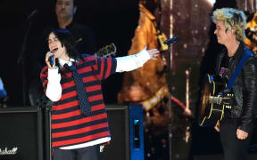Billie Eilish, left, performs with Billie Joe Armstrong of Green Day during the FireAid benefit concert at The Forum in Inglewood, California.