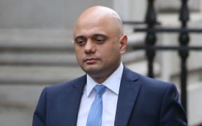 Britain's Chancellor of the Exchequer Sajid Javid walks at Downing Street, London, 13 February.