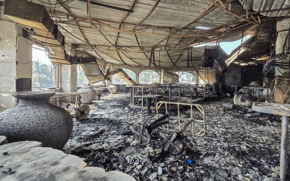 A burned-out interior is seen inside the Birch nightclub following a fire that broke out last midnight, in Goa on December 7, 2025. A  fire that ripped through an Indian nightclub in the popular tourist resort region of Goa killed 25 people, the state's chief minister said on December 7. (Photo by Atish NAIK / AFP)