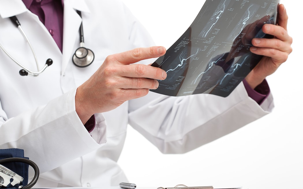 Doctor is making a diagnosis for a patient in medical office
