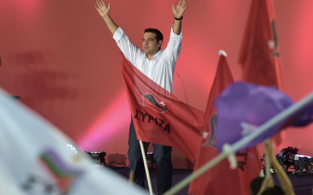 Syriza leader Alexis Tsipras greets his supporters during the party's main pre-election rally in central Athens.
