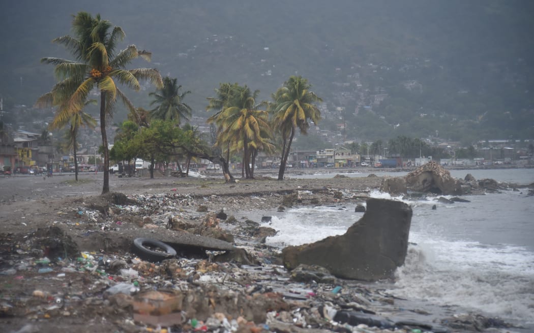 Debris and trash is seen on a beach in Cap-Haitien on the north coast of Haiti.