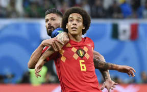 Belgium midfielder Axel Witsel (right) vies with France's forward Olivier Giroud during the Russia 2018 World Cup semi-final football match between France and Belgium at the Saint Petersburg Stadium.