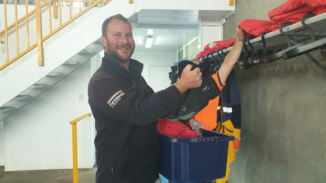 Helicopter pilot Paul McBrearty gets kitted out before heading into the pool.