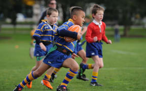Children play a school rugby game