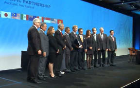 The delegates gather after the signing ceremony