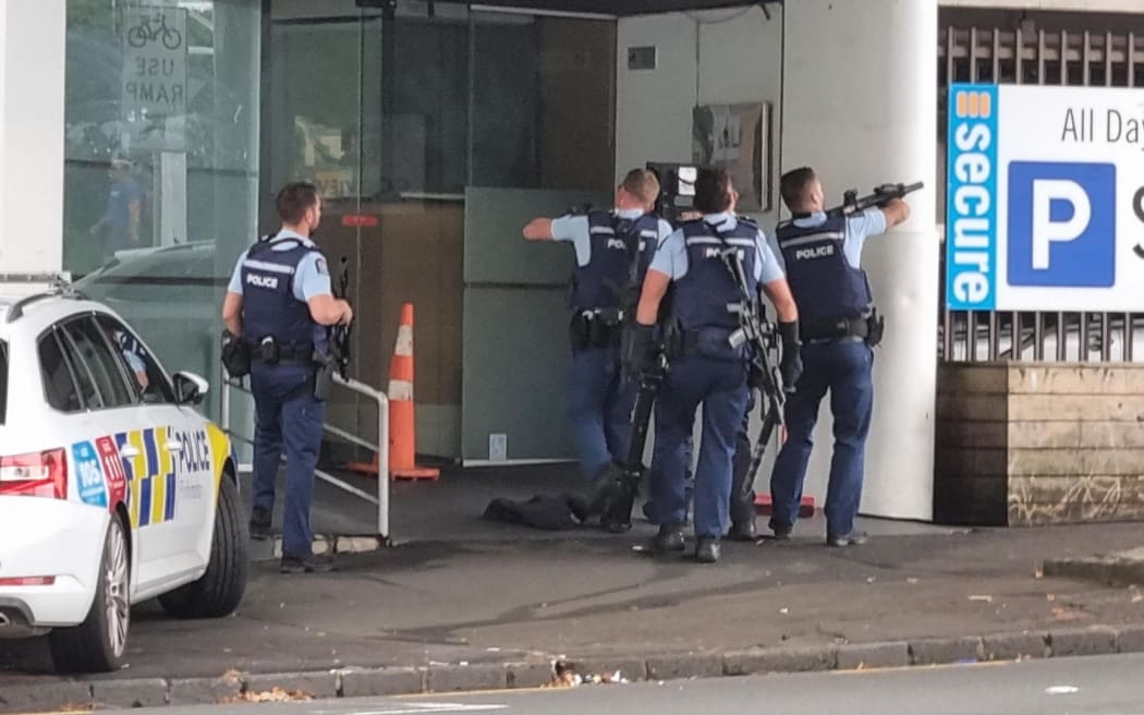 Armed entering the Goodview Apartment Hotel building. Hobson Street police incident 18 March 2024.