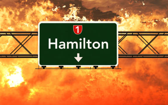 Hamilton New Zealand Highway Sign in a Breathtaking Sunset Sunrise 3D Illustration