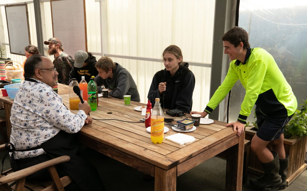 Parliament Speaker Adrian Rurawhe is interviewed by students at Tai Poutini Polytech students during an outreach visit to Westport by five MPs, during which the MPs cooked a BBQ sausage sizzle at the educational institution, 28 November, 2022.