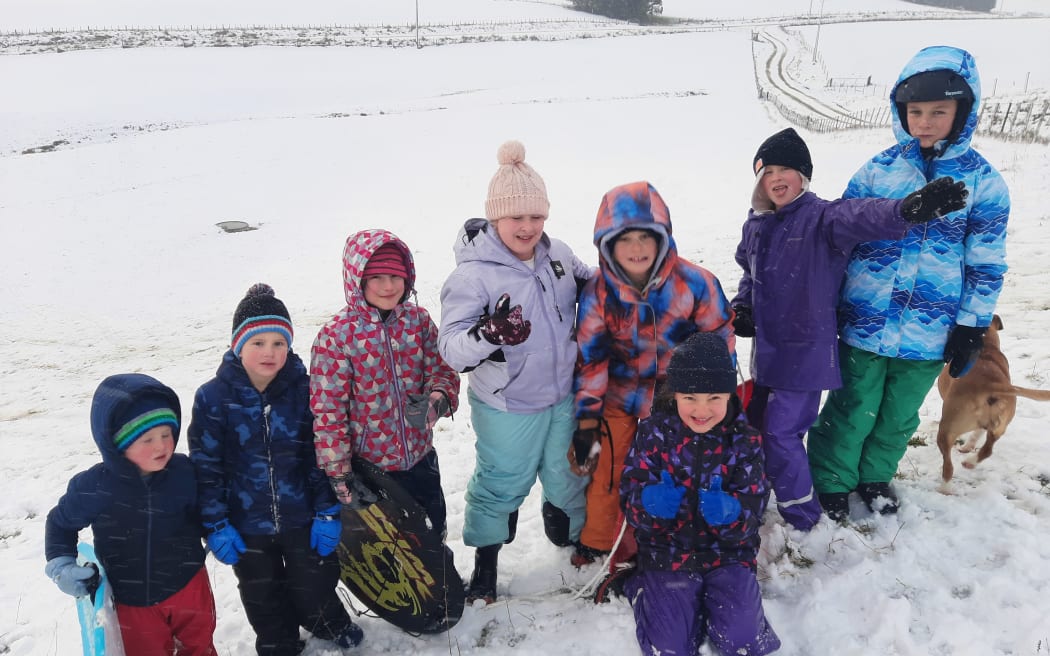 Children on Nick Parkes' farm in Owaka, South Otago, which is covered in snow.