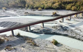 One of the Rangitata rail bridge's 34 piers was washed away in flood waters on 12 April, 2024, leaving a span of the bridge sagging.