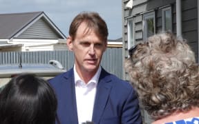 Deputy Mayor Jonathan Larsen, and current front runner in the mayoral race with a margin of just five votes, addresses the media.